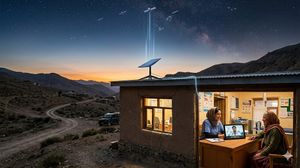 LEO satellite dish providing high-speed internet to a remote rural clinic for telemedicine consultations.